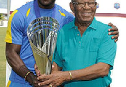 Barbados captain Kirk Edwards hugs Barbados and West Indies batting legend Sir Everton Weekes at the presentation of the Headley/Weekes Trophy. (WICB media)
