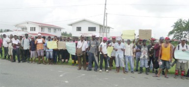 Sugar workers from the Blairmont estate during the picketing exercise in front of Freedom House at Bath, West Coast Berbice yesterday morning