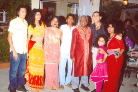 Ramdat Sookraj (wearing kurta) with members of three generations of the Sookraj family