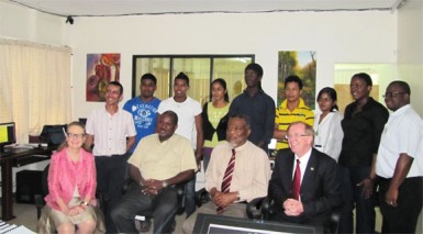 BrainStreet CEO Lance Hinds seen seated (second left) with Toon Boom CEO Joan Vogelsang (extreme left), Prime Minister Samuel Hinds and Canadian High Commissioner to Guyana David Devine.
