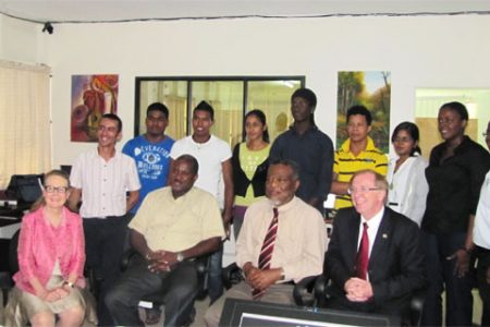 BrainStreet CEO Lance Hinds seen seated (second left) with Toon Boom CEO Joan Vogelsang (extreme left), Prime Minister Samuel Hinds and Canadian High Commissioner to Guyana David Devine.