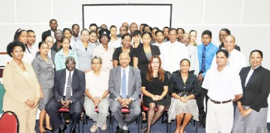 Chancellor of the Judiciary Justice Carl Singh (sitting at centre) with facilitators and participants after the workshop was declared open. 