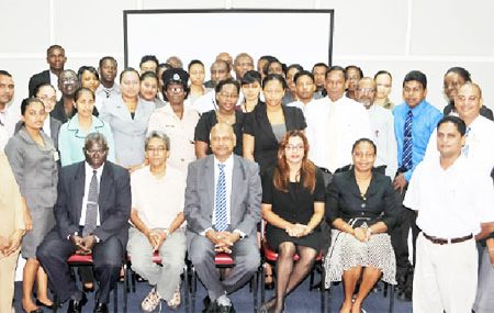 Chancellor of the Judiciary Justice Carl Singh (sitting at centre) with facilitators and participants after the workshop was declared open.
