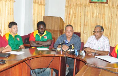 Director of Sport, Neil Kumar makes a point at yesterday’s press briefing ahead of today’s rubgy match versus Barbados as National Captain and Coach, Ryan Gonsalves and Theodore Henry and the GRFU’s top brass look on. (Orlando Charles photo)