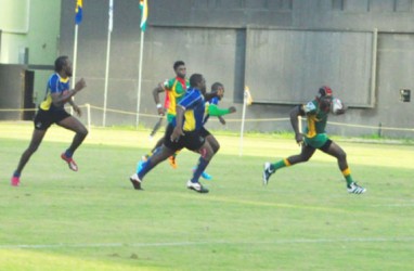 Catch Me If You Can! Guyana’s Avery Corbin sprints to record one of his two tries yesterday in the NACRA Senior Men’s 15 Caribbean Championships game against Barbados yesterday at the Providence National Stadium. (Orlando Charles photo)