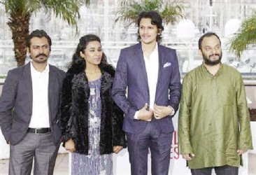 Cast members Nawazuddin Siddiqui, Tannishtha Chatterjee, Vijay Varma and director Amit Kumar pose during a photocall for the film ‘Monsoon Shootout’ at the 66th Cannes Film Festival in Cannes May 18, 2013. REUTERS/Regis Duvignau 