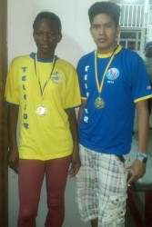 Alika Morgan and Samuel Kaitan with their gold medals from the Telesur 10k road race.    