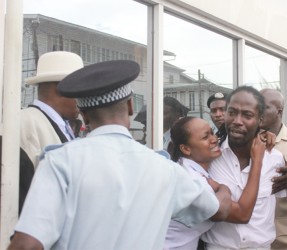 Female hugs Shaka Chase during drama outside court yesterday 