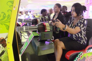 Not to be left out, moms playing a virtual military game at the opening of the Princess Hotel Fun City yesterday (Photo by Arian Browne) 
