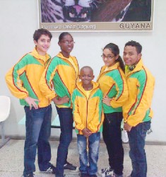 The local swimmers before departing for this weekend’s 22nd Aquatic Centre International swim meet in Barbados.   