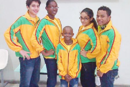 The local swimmers before departing for this weekend’s 22nd Aquatic Centre International swim meet in Barbados.
