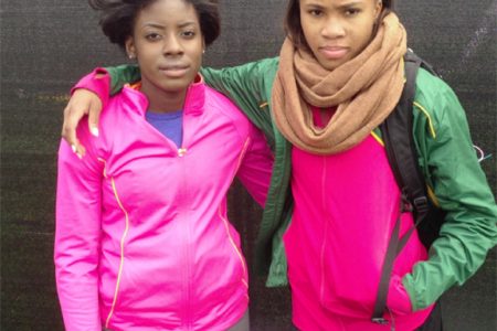 Guyana’s Kadacia Baird (right) and compatriot  Brenessa Thompson take time out for a photo opportunity at New York’s Icahn Stadium yesterday.
