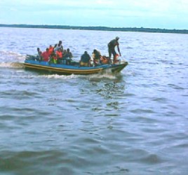 The search party returning to Bartica yesterday  from Matouk Falls, Cuyuni River. 