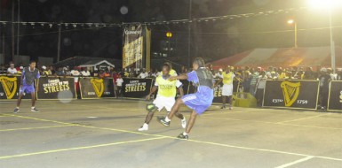 Action in the Guinness of the Streets National Championships between Silver Bullets in black and Leopold Street in yellow.