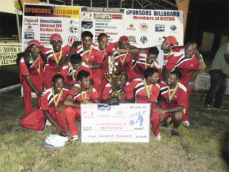 CHAMPS AGAIN! Universal DVD Berbice Titans after their triumph on Sunday over the Georgetown Lions. 