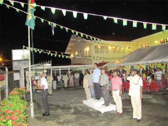 Attorney General and Minister of Legal Affairs Anil Nandlall (fourth from right on podium)  and other officials witness the hoisting of the Golden Arrowhead in the compound of the Regional Democratic Council of Region Three. The occasion was the annual flag raising ceremony to mark Guyana’s 47th Independence anniversary.