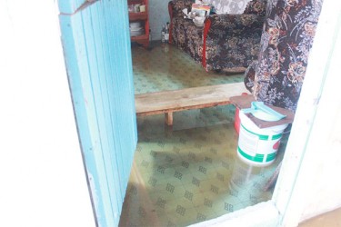 Inside the flooded home of a Malgre Tout villager.