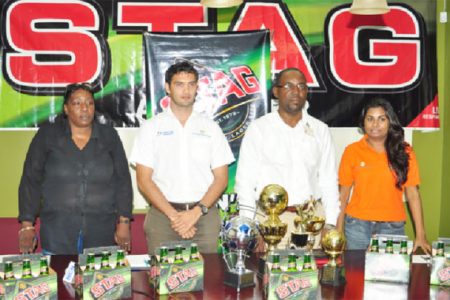 Vice President of the West Demerara Football Association (WDFA), Christine Schmidt (left) along with John Maikoo (second from left), VP of the GFF Rawlston Adams (third from left) and Darshanie Yussuf pose for a photo opportunity at the completion of yesterday’s launch of the 2nd annual Stag/West Demerara Football Senior League Tournament. (Orlando Charles photo)