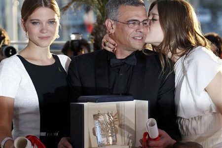 Director Abdellatif Kechiche poses with cast members during a photocall after receiving the Palme d'Or award at the closing ceremony of the 66th Cannes Film Festival