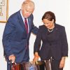 United States Vice-President Joe Biden tries his hand on the pan which was presented to him by Prime Minister Kamla Persad-Bissessar, right, at the Diplomatic Centre, St Ann’s yesterday on the final day of his two-day visit to Trinidad. Biden and his wife Dr Jill Biden and their two granddaughters Maisy and Niaomi left Trinidad yesterday for Brazil