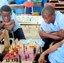 These two deaf students are engrossed in a game of chess.