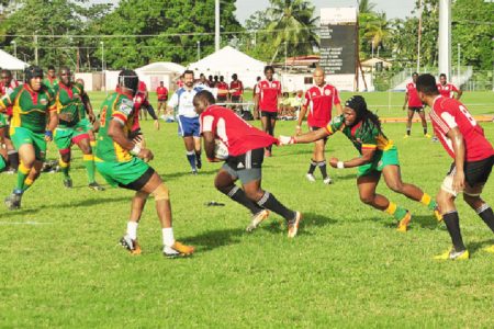  Guyana’s rugby players failed to rein in Trinidad and Tobago’s ruggers who sped to a 20-0 victory in the final of the NACRA 15-a-side championships yesterday at the UWI Campus ground, St. Augustine. (Orlando Charles photo)
