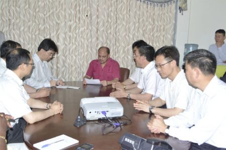 Minister of Health, Dr Bheri Ramsaran (centre in background) interacting with the visiting team of doctors from  China.  (GINA photo)