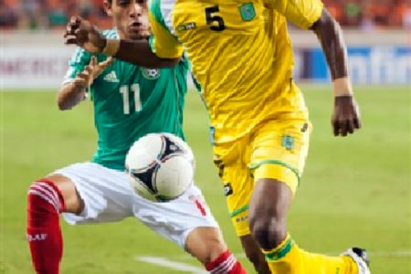 Walter `Boyd’  Moore in action for Guyana against Mexico in a World Cup qualifier.