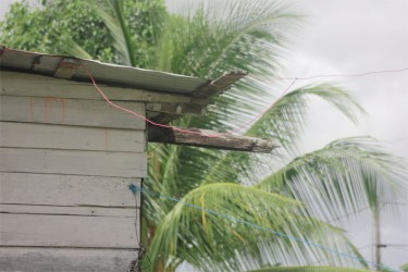 An illegally connected wire provides electricity to this house. 