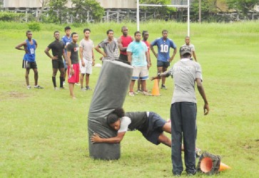 The National Under-19 ruggers going through Thursday’s first practice session at the National Park Rugby field ahead of this year’s North American and West Indies Rugby Association (NACRA) 15s tournament which kicks off on July 6 in Trinidad and Tobago. (Orlando Charles photo) 