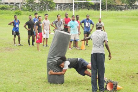 The National Under-19 ruggers going through Thursday’s first practice session at the National Park Rugby field ahead of this year’s North American and West Indies Rugby Association (NACRA) 15s tournament which kicks off on July 6 in Trinidad and Tobago. (Orlando Charles photo)
