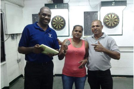 The winning pair Lallchand Rambharose and Jaswantie Hiralall with Bryan James (extreme left) 