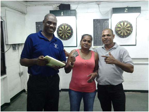 The winning pair Lallchand Rambharose and Jaswantie Hiralall with Bryan James (extreme left) 