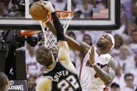 REJECTED! Miami Heat small forwards LeBron James helped his team repel the San Antonio Spurs offense. (Reuters photo)