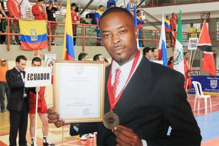 ANOTHER FIRST! Guyana’s first World Championship boxing promoter Carwyn Holland shows off his SAMBO certificate.
