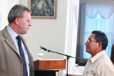 EU Ambassador Robert Kopecký and former Region Nine Chairman Clarindo Lucas during a discussion at the launch of the Justice Institute Guide to making an Amerindian land claim on Tuesday. 