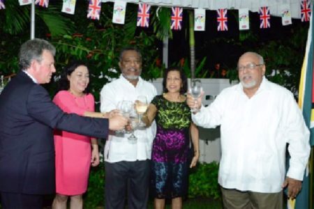 British High Commissioner Andrew Ayre (left) and President Donald Ramotar sharing a toast (GINA photo)