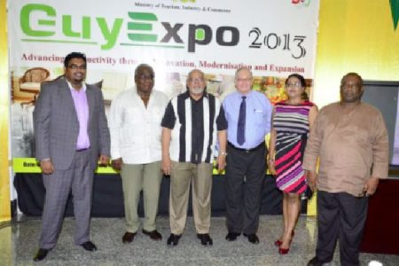 President Donald Ramotar at the launch of GuyExpo 2013 with a team that includes acting Minister of Tourism Industry and Commerce Irfaan Ali, Chairman of the Private Sector Commission Ron Webster and President of the Guyana Manufacturing and Services Association Clinton Williams. (Government Information Agency photo)