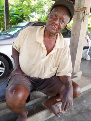 A village elder, Andrew McPherson, speaks on issues of land tenure in the village.