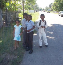 Boys and girl waiting on transportation