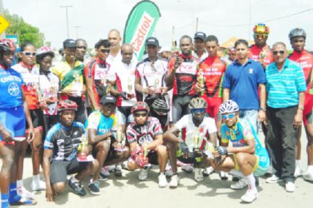 Winners and runners up of the 14th annual Father’s Day 50-mile road race which was sponsored by Guyoil under its Castrol brand pose for a photo opportunity at the event’s completion. (Orlando Charles photo)