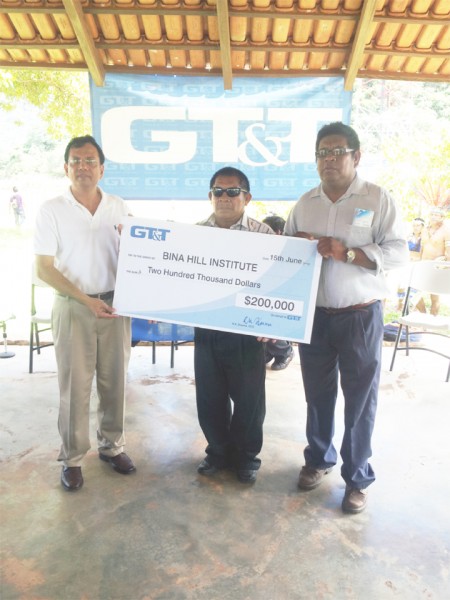 GT&T yesterday donated $200,000 to the Bina Hill institute in North Rupununi to assist with the development and sustainment of the institute.  From left: GT&T CEO R K Sharma , Chairman of the NRDDB Michael Williams and CEO of NRDDB Ivor Marslow hold up the cheque. 