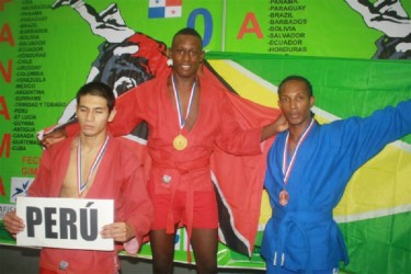 Guyana bronze medalist Paul Ignatius takes the podium alongside the silver medalist from Peru and Gold Medalist Joash Walkins from Trinidad. 