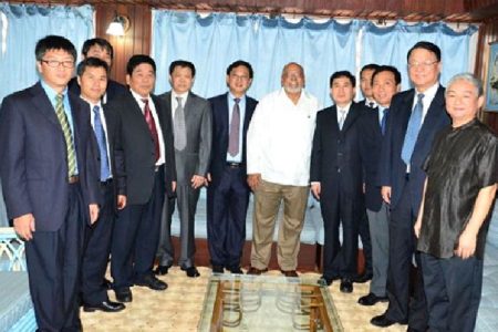 President Donald Ramotar (centre) with a delegation from China Chengtong Holdings Group Limited. Chinese Ambassador to Guyana Zhang Limin (right) accompanied the group. (GINA photo) 