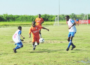 Tevin Garraway takes possession of the ball during the match with St. John’s College in the Digicel’s Schools Football Championship, yesterday afternoon at the Ministry of Education Ground, Carifesta Avenue (Orlando Charles photo.) 