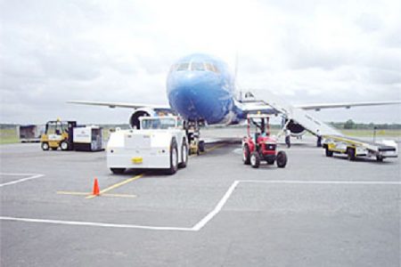 A plane on the ground at the Cheddi Jagan International Airport, Timehri (Stabroek News file photo)