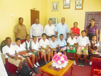 The top ten performers sitting. Region Five Chairman Brindrabhan Bisnauth is standing third from right