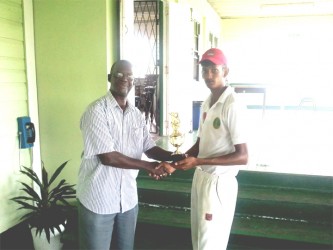 Derek Narine receives his man of the match trophy from Chairman of the GCB Competitions Committee, Colin Europe.