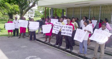 Picketers congregate at the admissions building after the march around campus 