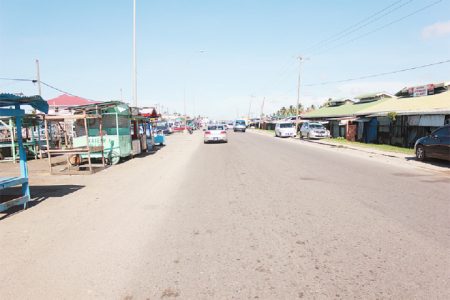 On the right are some of the Mon Repos Market stalls that have to be removed to facilitate the extension of the East Coast four-lane road. (Photo by Arian Browne)